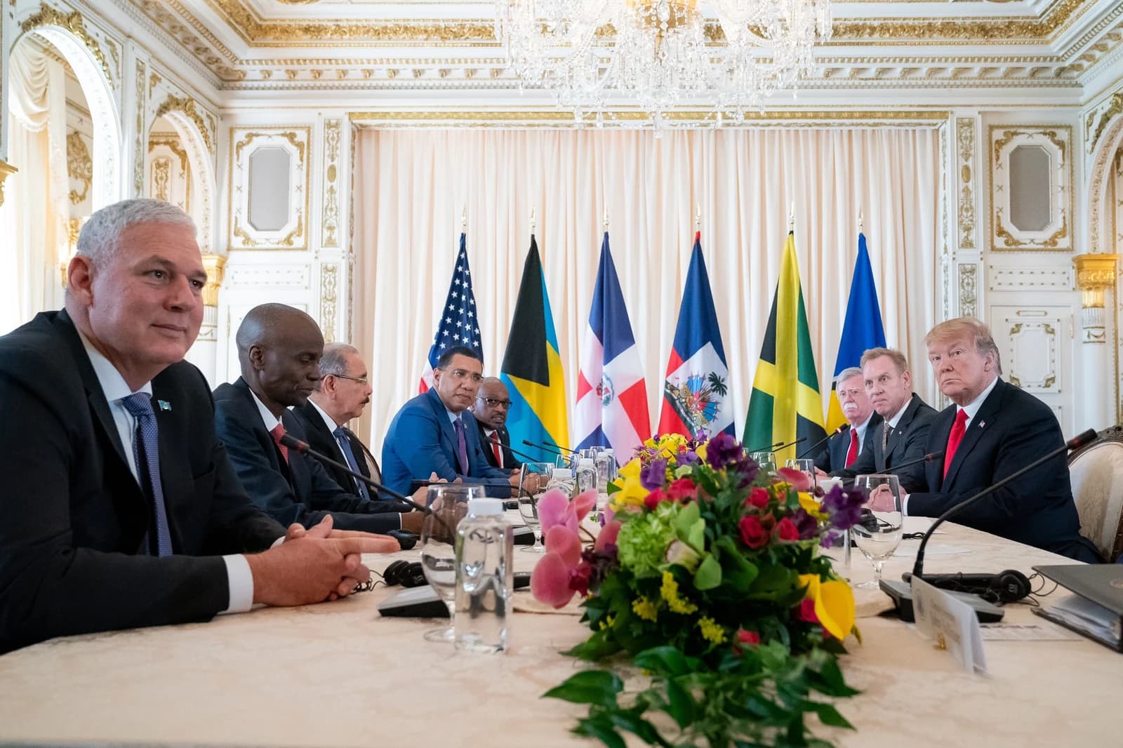 Donald Trump, President of the United States, seated at a long table with several Caribbean leaders.