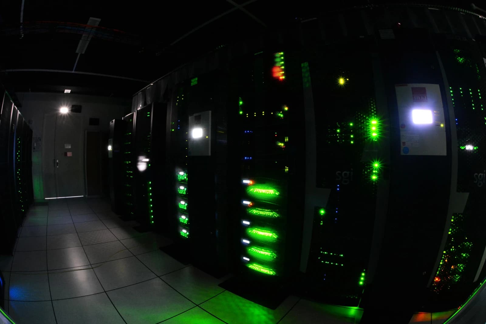 Interior view of Le Centre Datarmor with server racks glowing green.