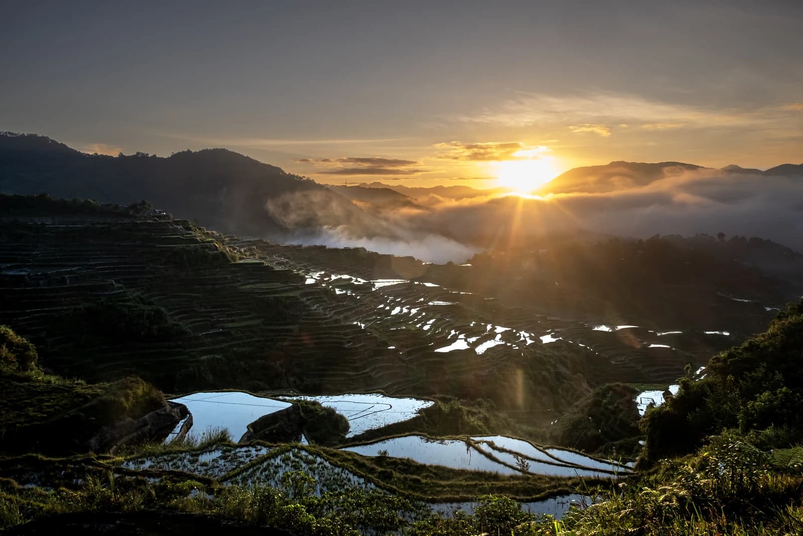 Sunrise over Maligcong Rice Terraces in the mountains of the Philippines.