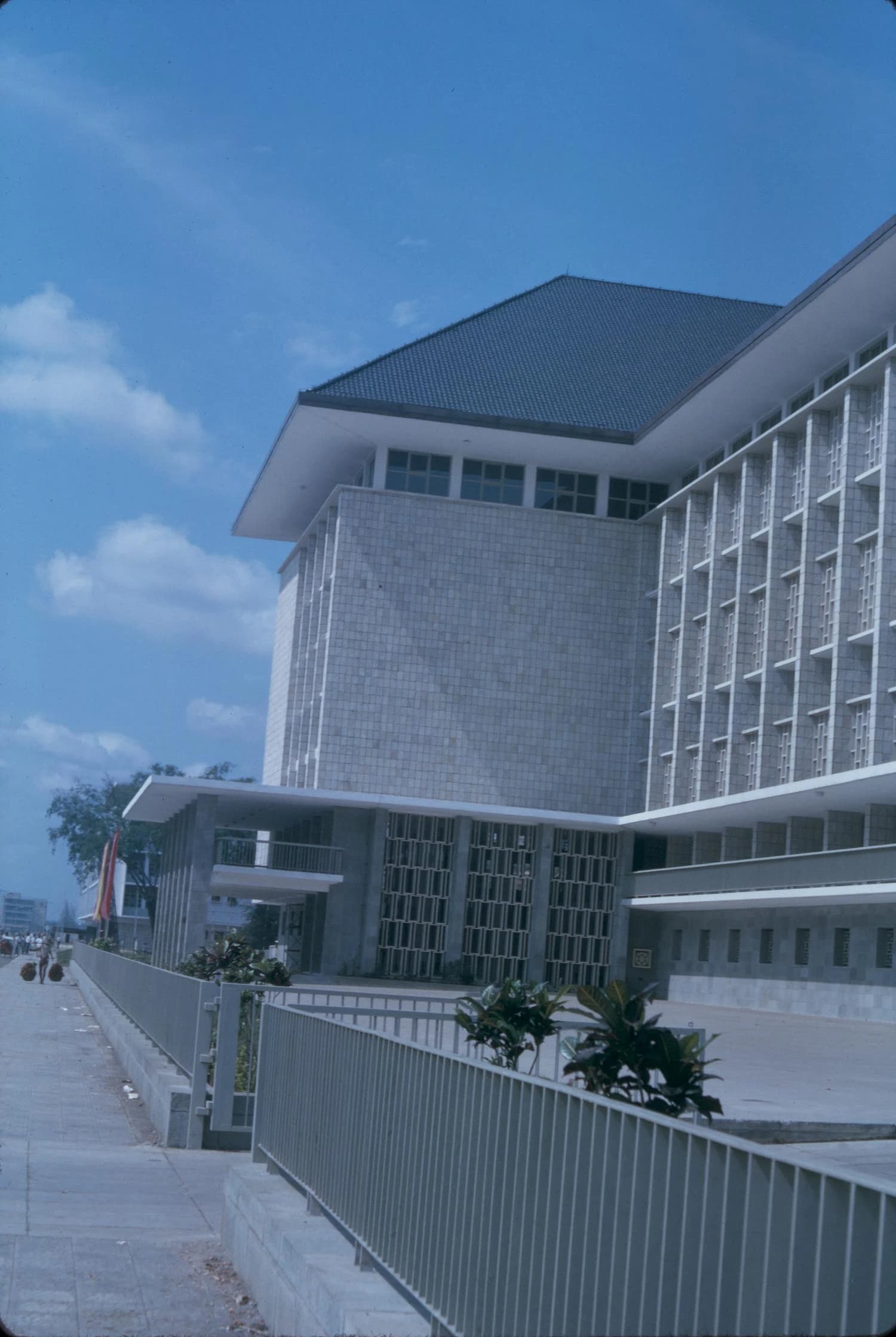 White facade and fencing of Central Bank of Indonesia building in Jakarta, Indonesia.