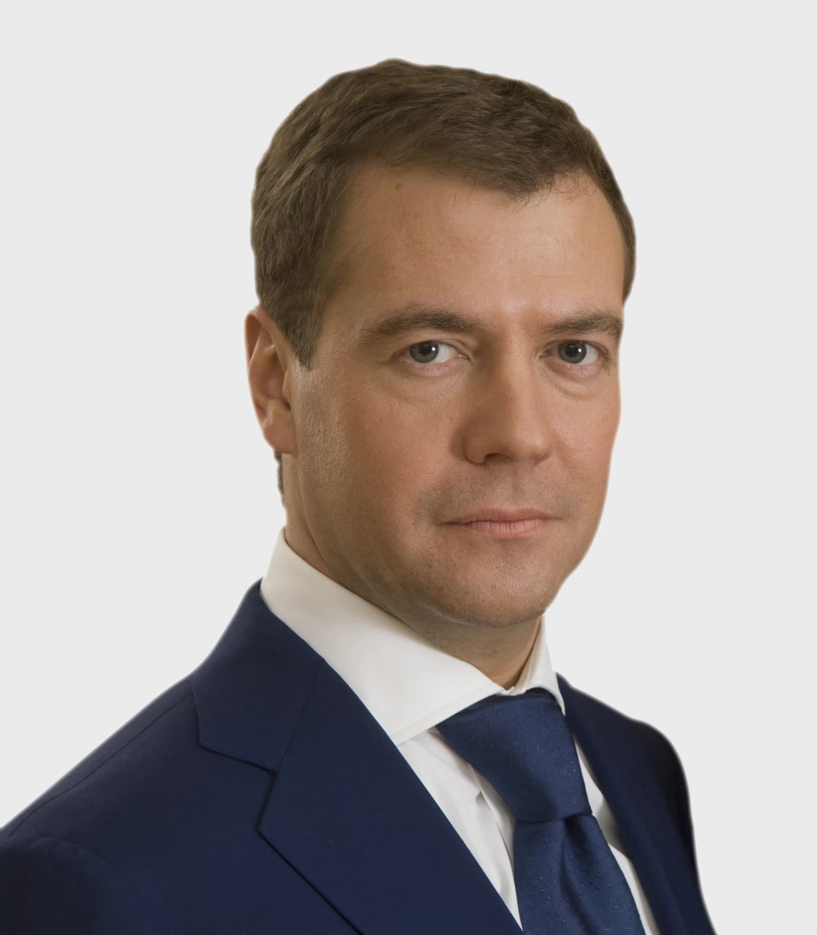 Dmitry Medvedev, former Russian President, in an official portrait against a plain background.