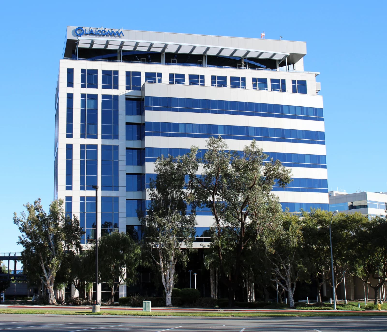 Exterior view of Qualcomm's headquarters building in La Jolla, California on a clear day.