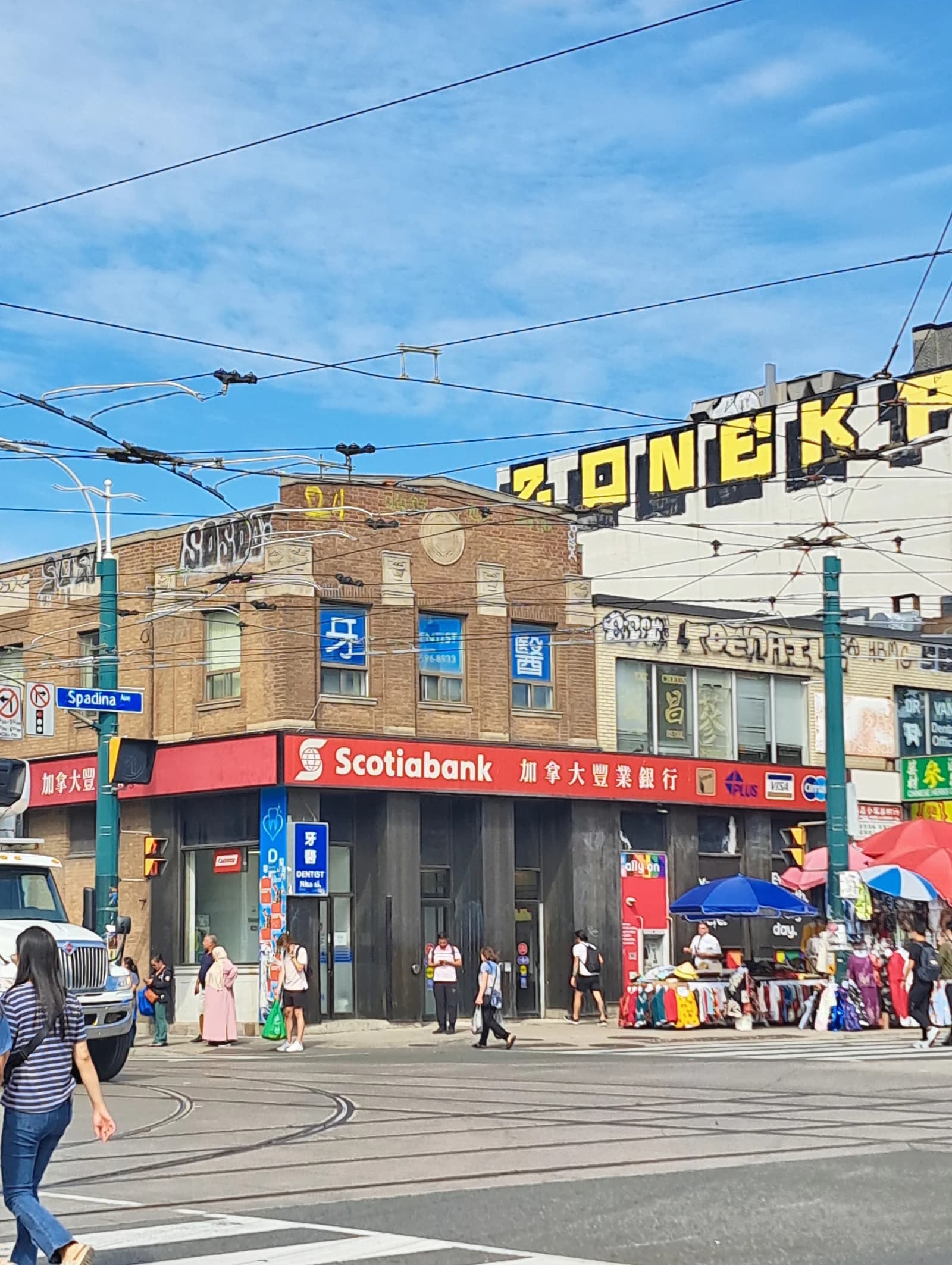 Scotiabank branch at Spadina and Dundas, Toronto Chinatown, with people crossing street.