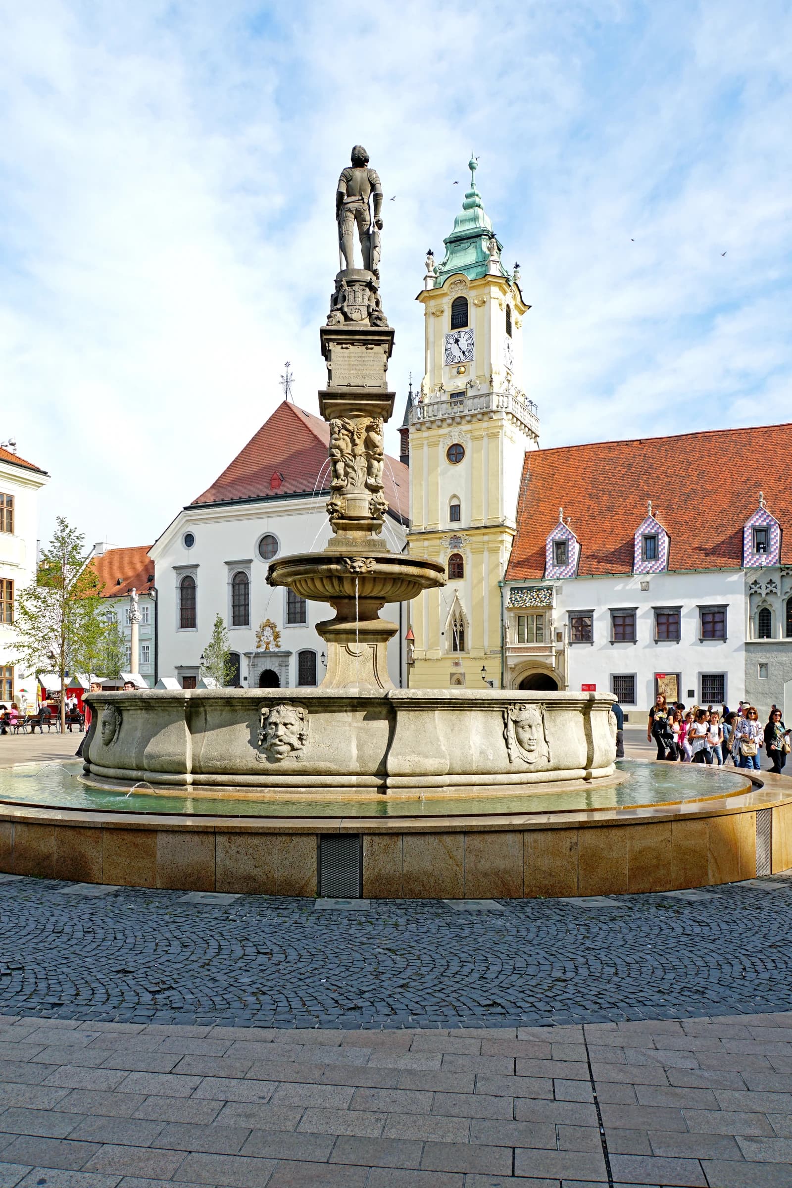 Roland Fountain and Old Town Hall clock tower in Bratislava, Slovakia.