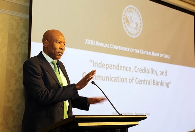 Lesetja Kganyago, Governor of the South African Reserve Bank, speaking at a podium.