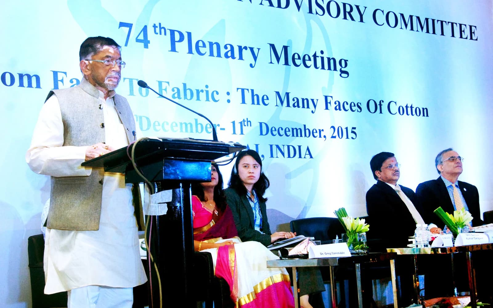 Santosh Kumar Gangwar, Minister of State for Textiles, speaking at a podium during a meeting.