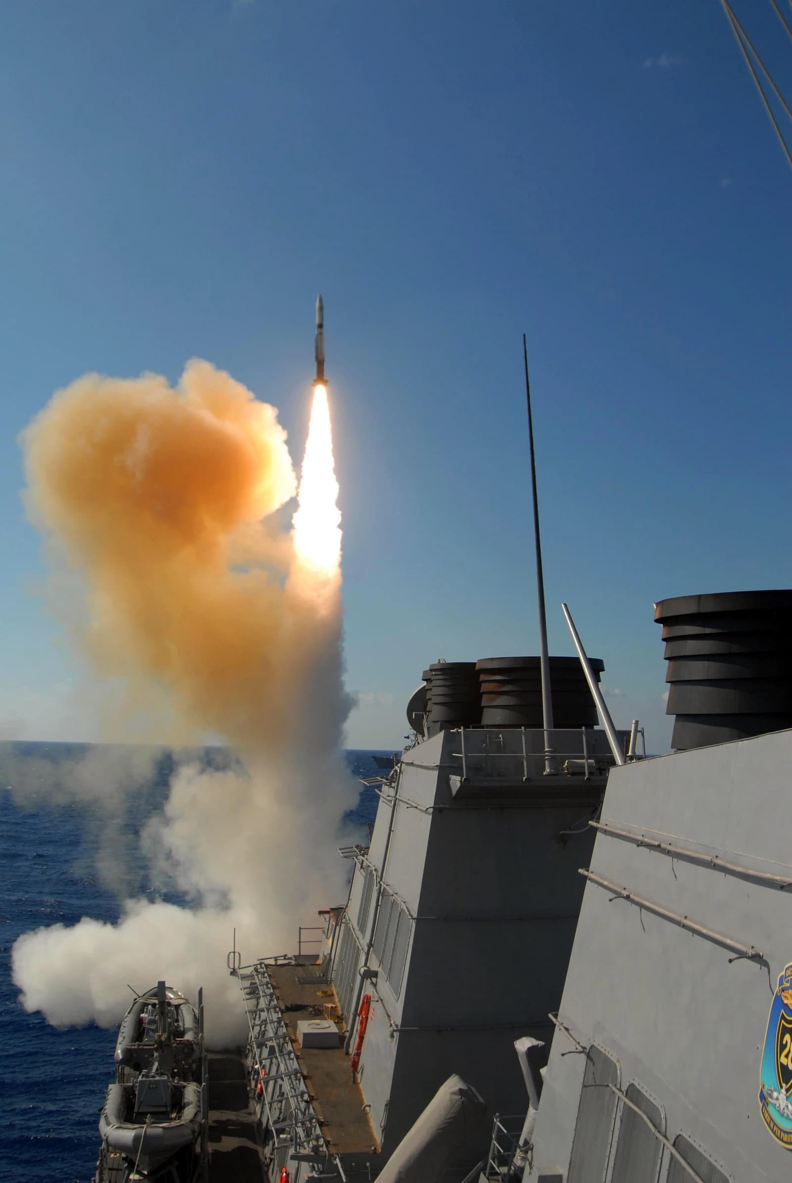 USS Stout, a guided missile destroyer, launches an SM-2 Standard Missile from its aft missile bay.