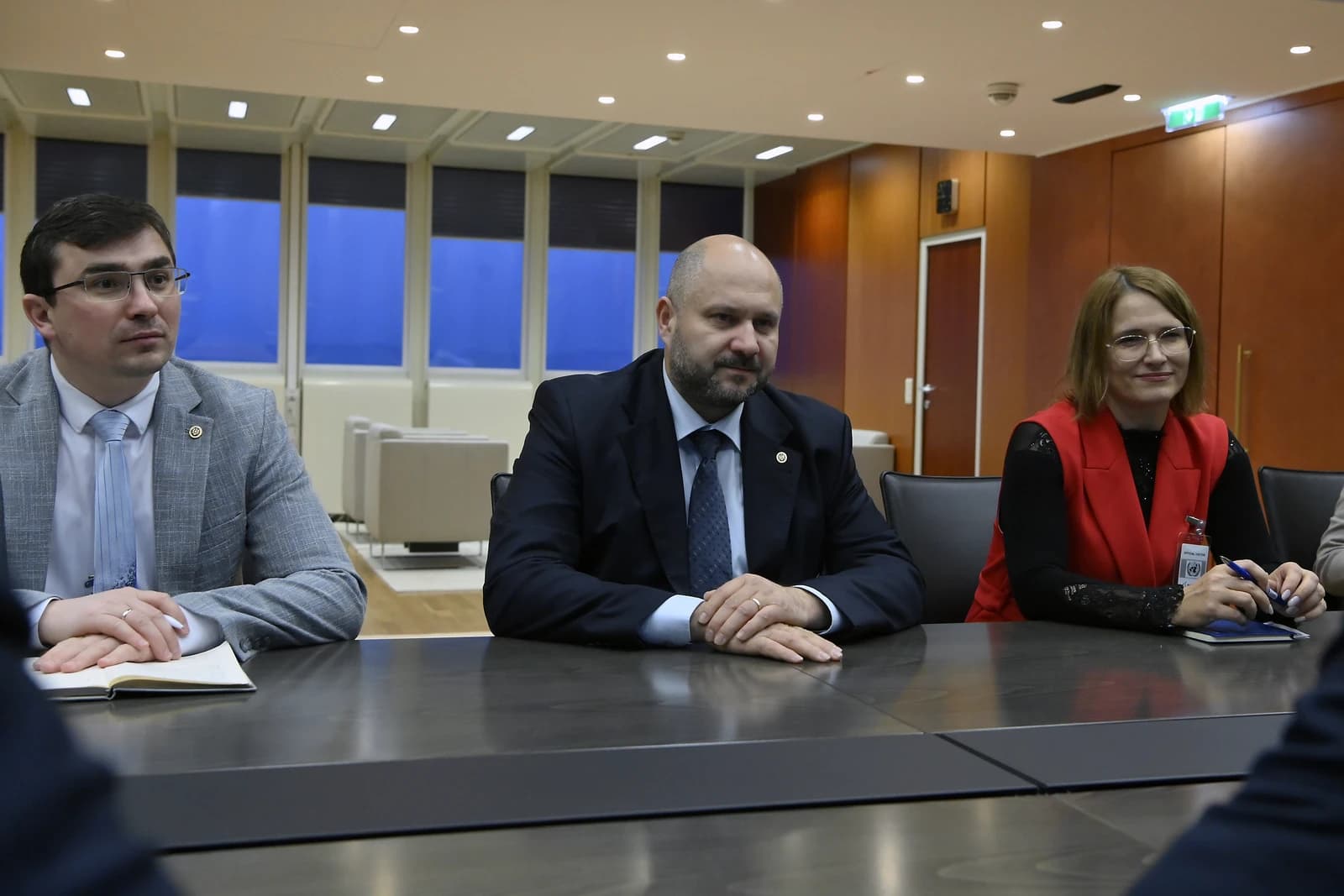 Victor Parlicov, Minister for Energy of Moldova, seated at a table with two other people.