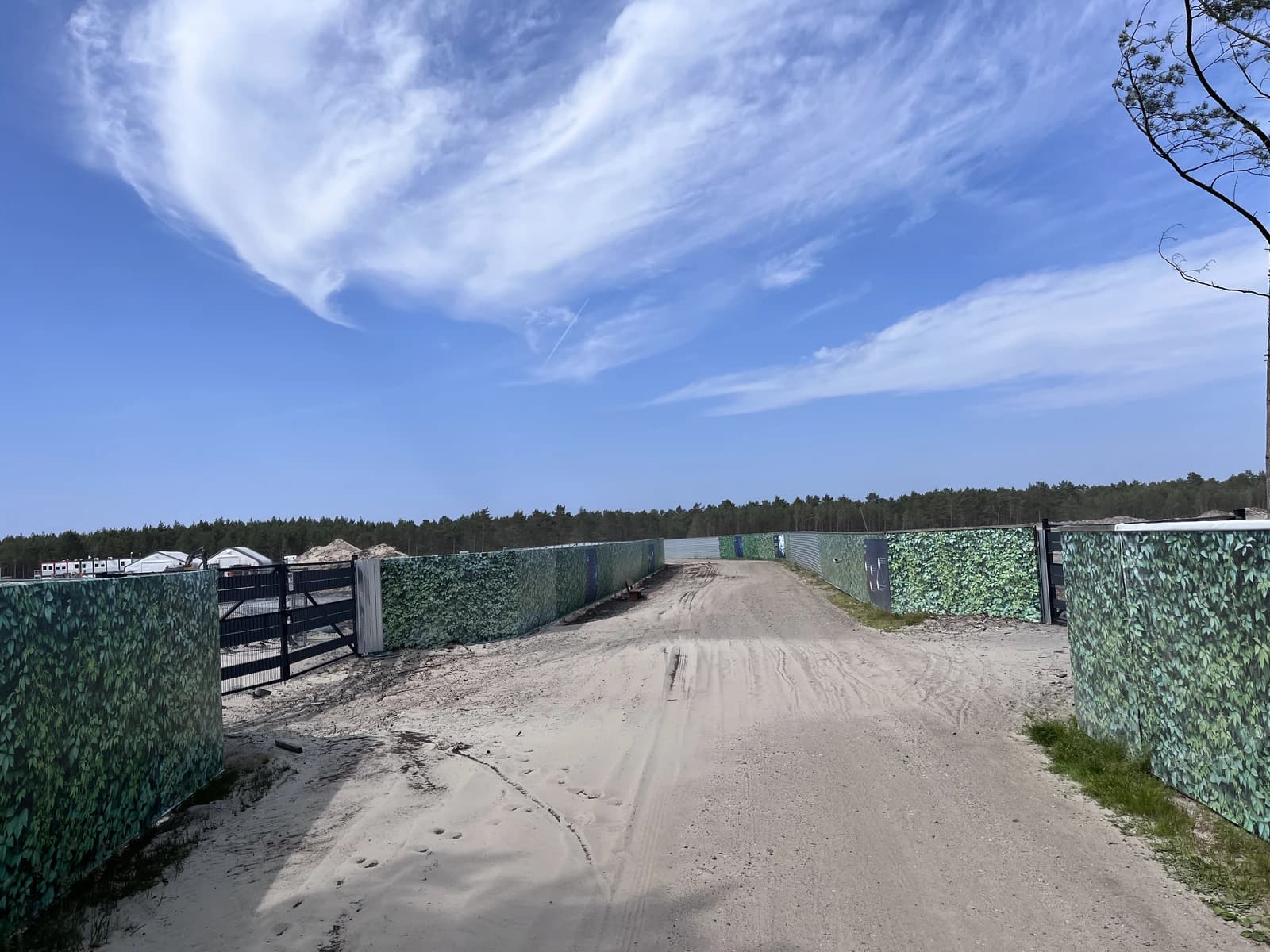 Fenced-off dirt road at the Lubiatowo-Kopalino Choczewo Nuclear Power Plant site.