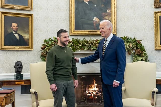 President Joe Biden and President Volodymyr Zelensky standing next to each other in the Oval Office.