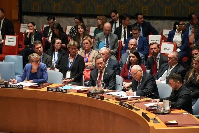 Volodymyr Zelenskyy, President of Ukraine, seated at the Ukraine desk at the UN General Assembly.