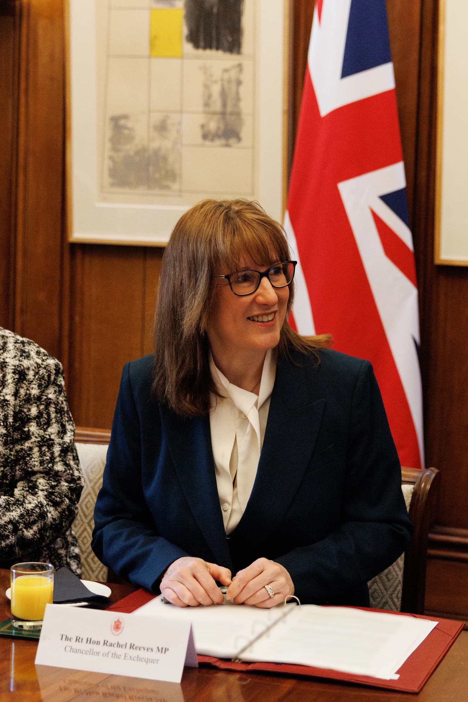 Rachel Reeves, Chancellor of the Exchequer, sitting at a table during a meeting.