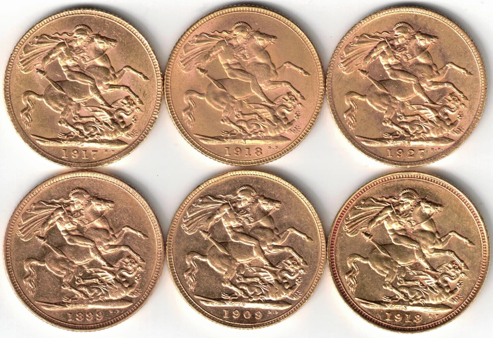 Six Branch Mint gold sovereign coins, showing St. George slaying the dragon.