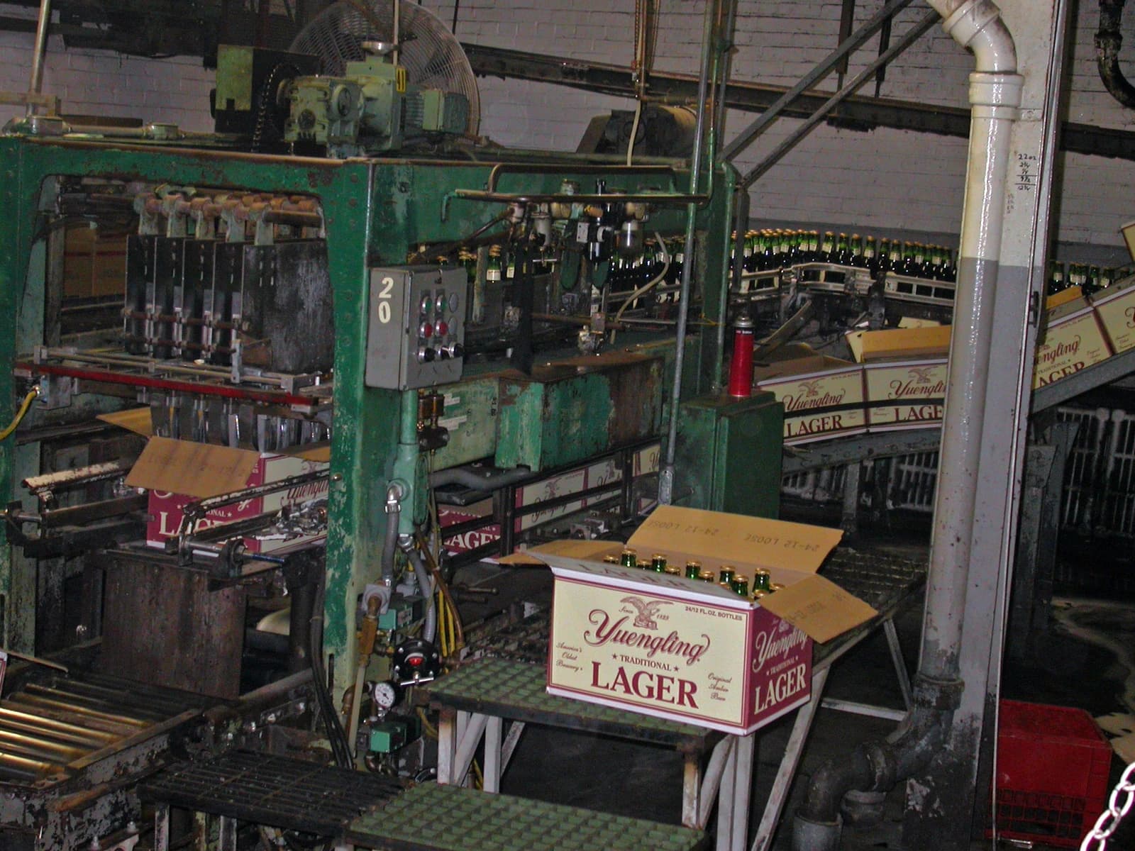 Yuengling beer bottles move along a production line inside a brewery.