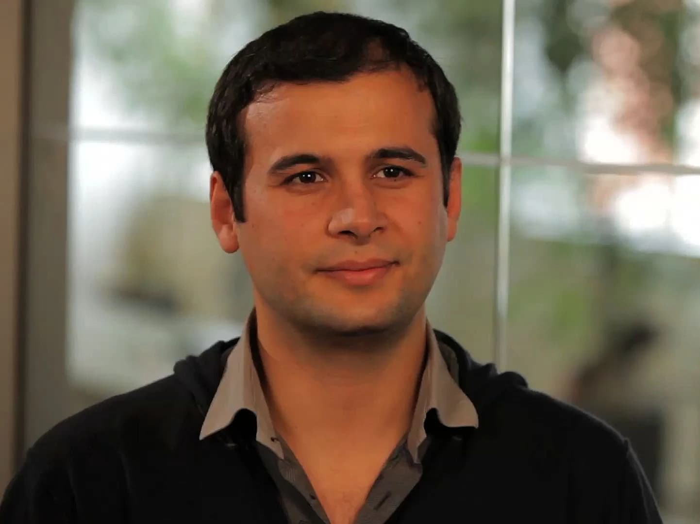 Eren Bali, Udemy co-founder, looking directly at the camera indoors.