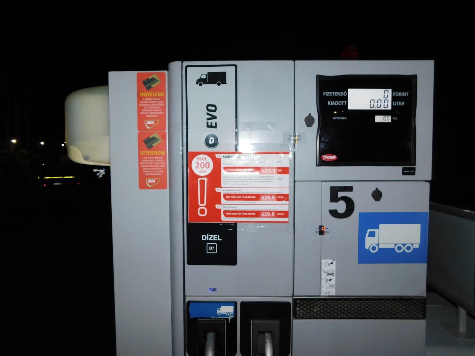 Close-up of a fuel dispenser at a MOL gas station displaying diesel prices.