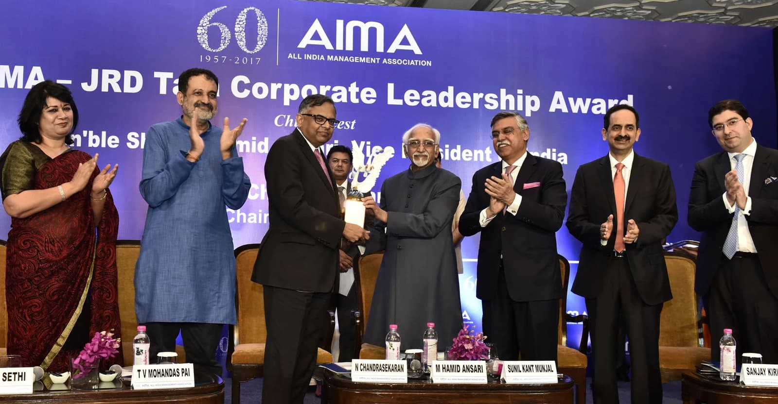 N. Chandrasekaran, Chairman of Tata Sons Ltd., receives an award from M. Hamid Ansari.