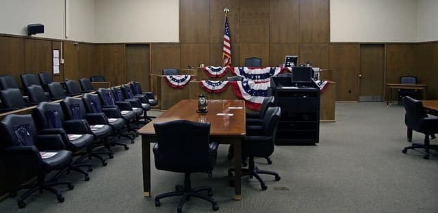 Courtroom at the Hannibal Federal Building and U.S. Courthouse, with an American flag.