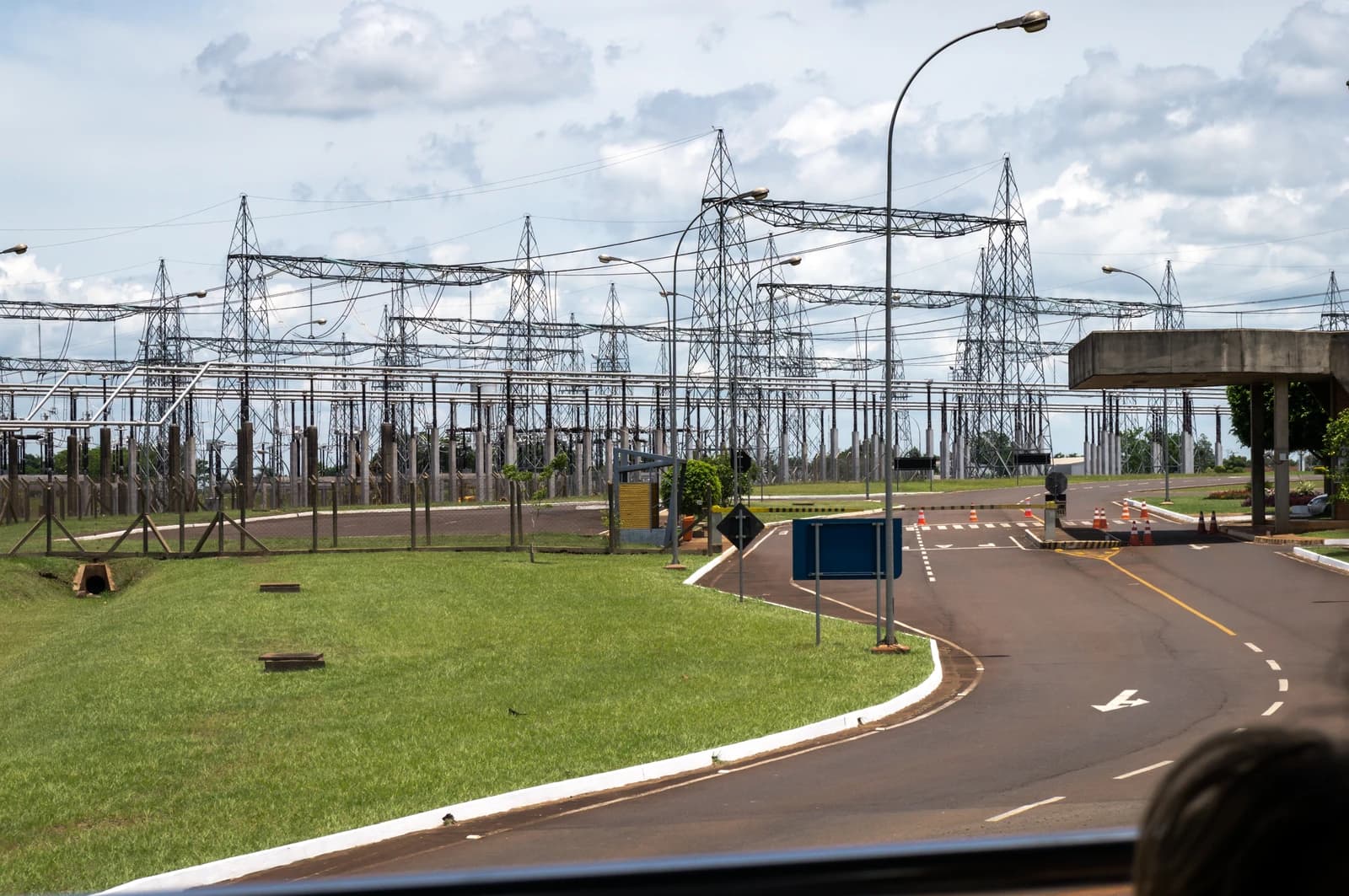 Itaipu Binacional hydroelectric dam substation with numerous power lines and transmission towers.