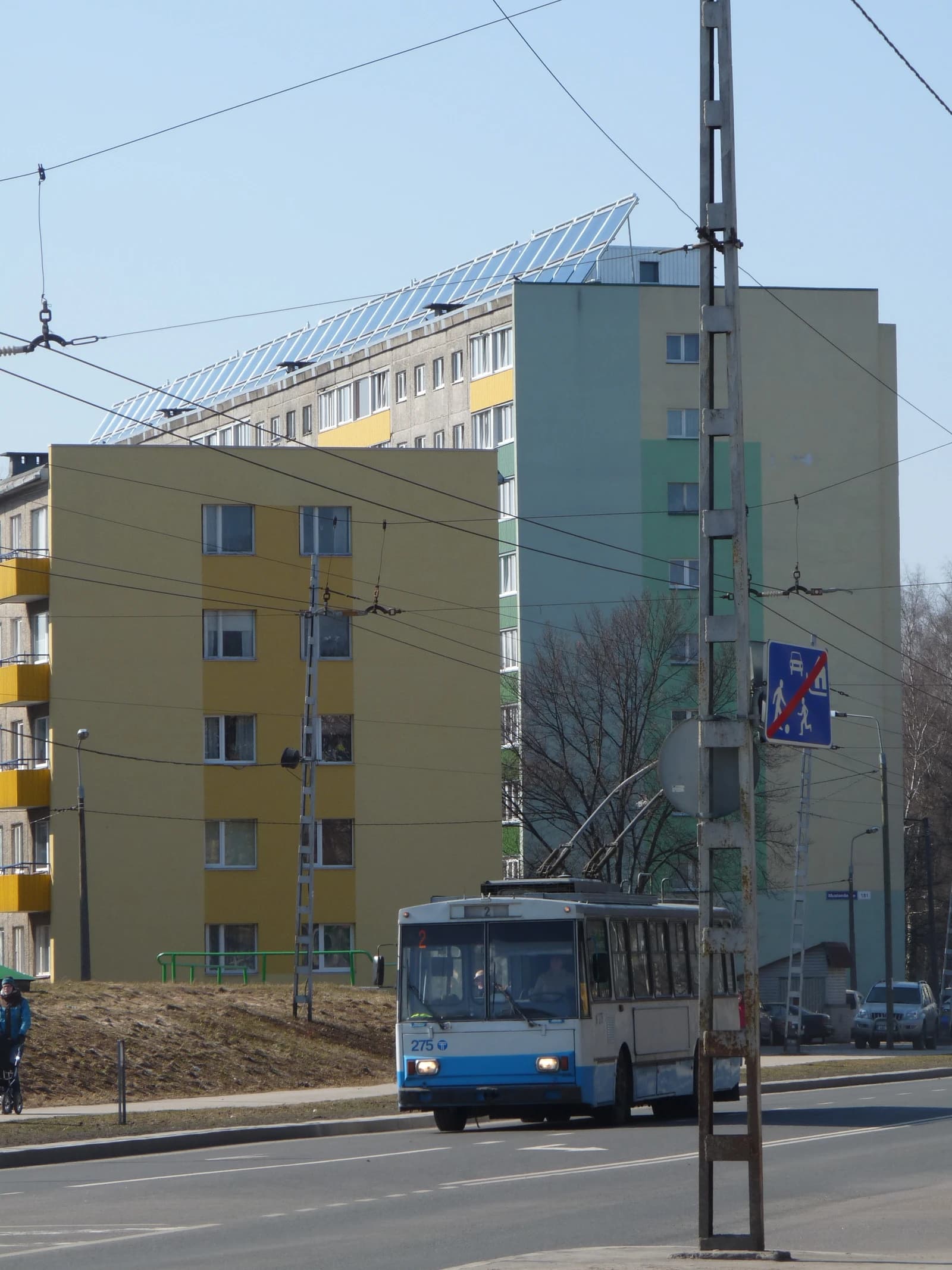 Solar panels installed on the roof of a large residential building in Tallinn, Estonia.