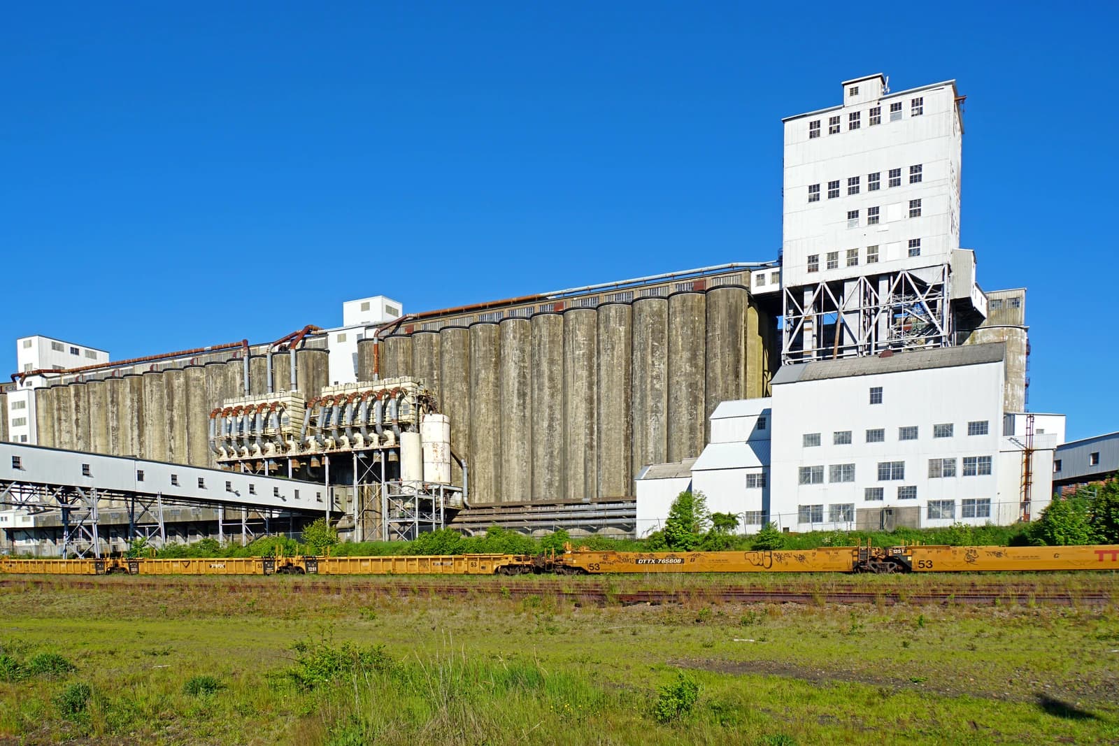 A large grain elevator complex in Halifax, Nova Scotia, with rail cars below.