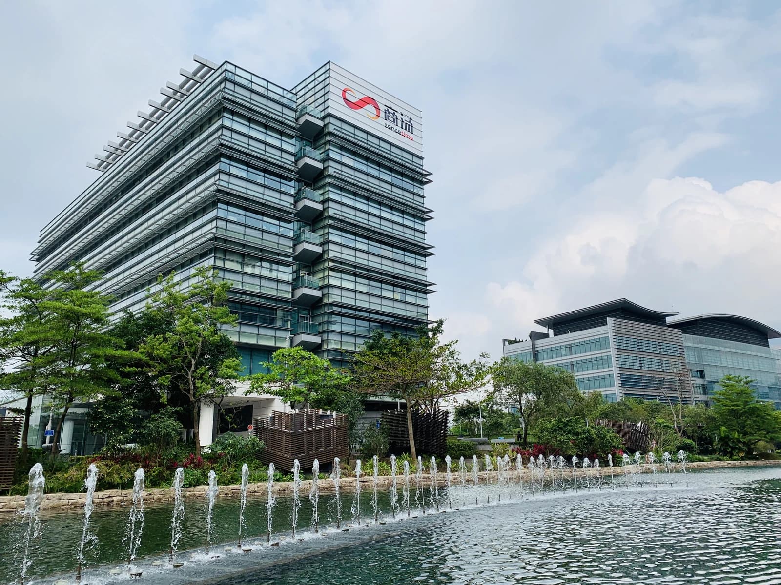 Exterior view of SenseTime headquarters building in Hong Kong on a cloudy day.