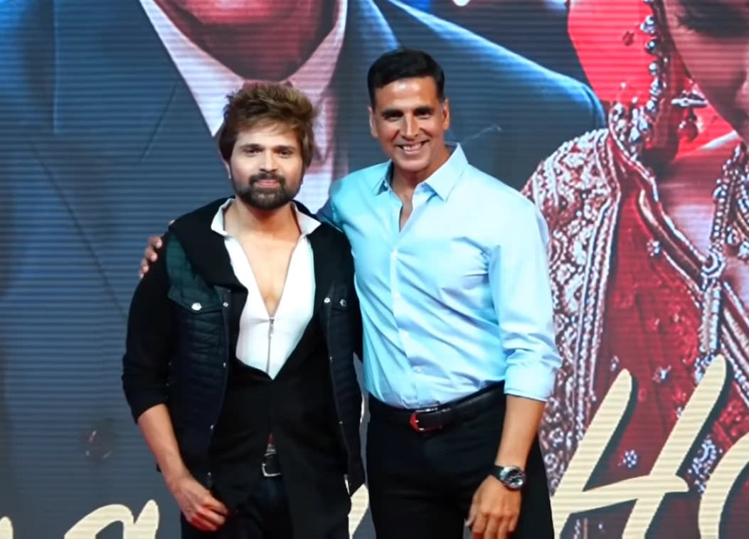 Himesh Reshammiya and Akshay Kumar standing side-by-side at an event.