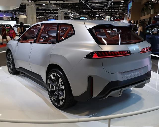 BMW Vision Neue Klasse X showcar displayed from the rear at an auto show.