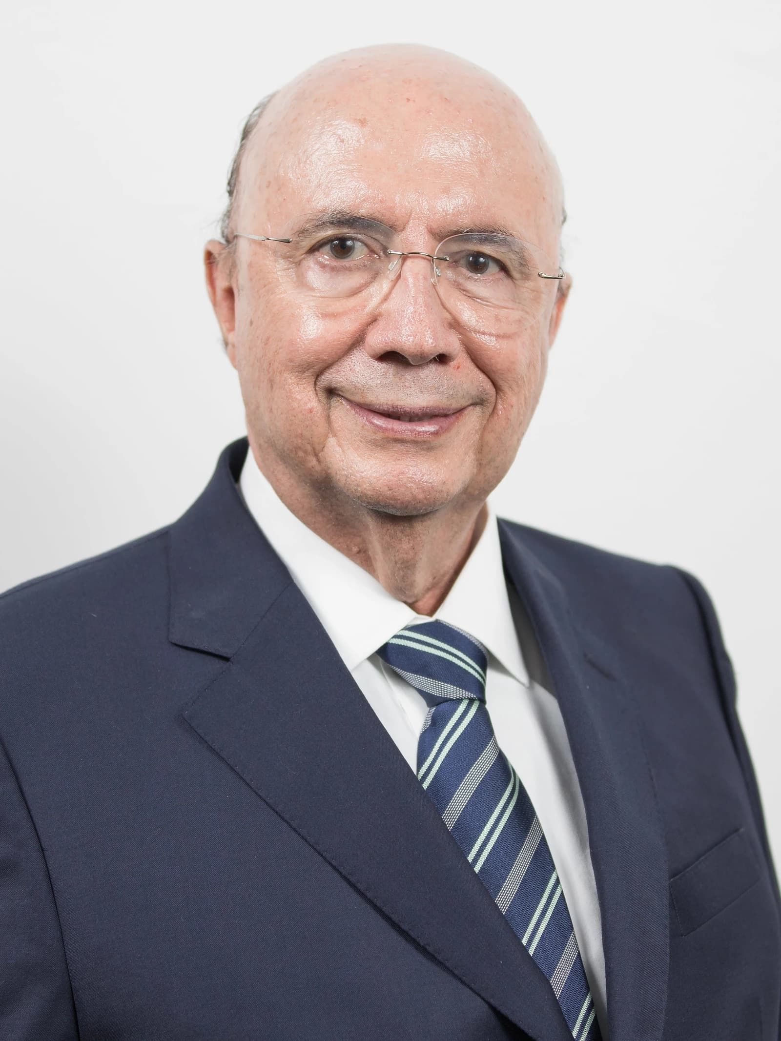 Henrique Meirelles, Secretary of Finance, Planning, and Management, smiling and looking forward.