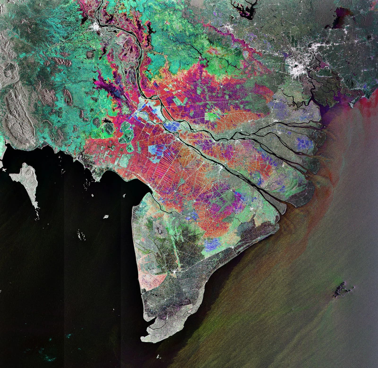 Satellite image of Vietnam's Mekong Delta with colorful agricultural and urban areas.