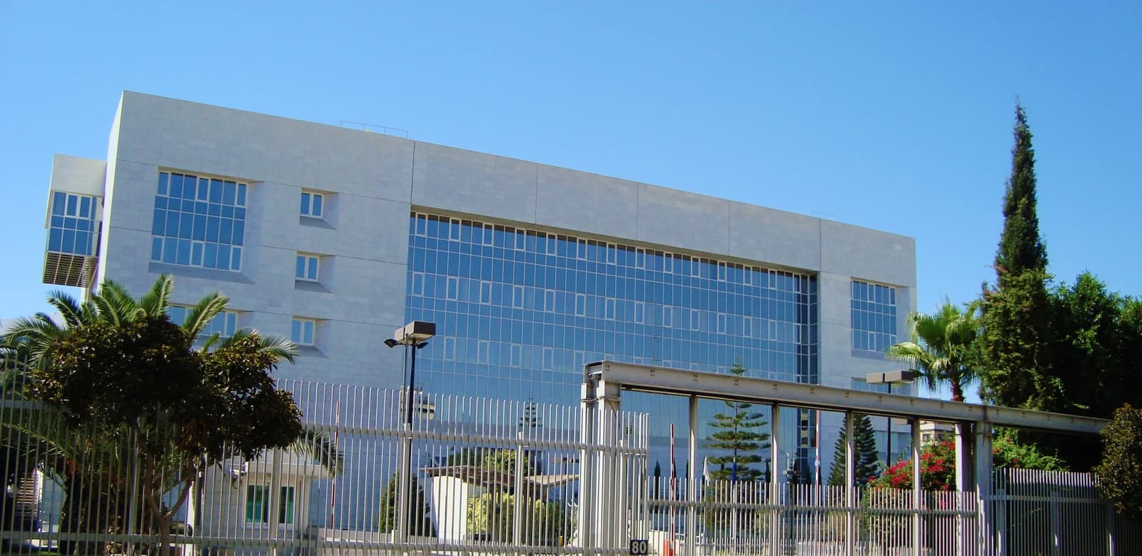 Exterior view of the Cyprus Central Bank building under a clear blue sky.