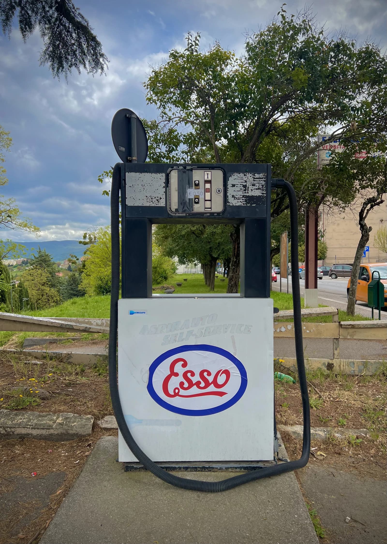 An Esso self-service gas pump with the logo visible in Calabria, Italy.