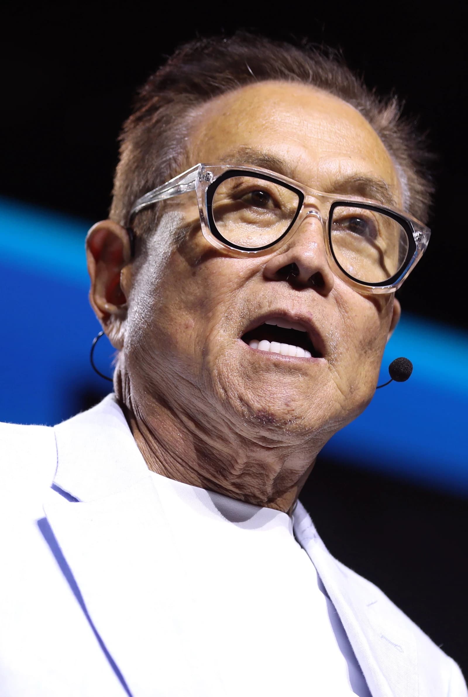 Robert Kiyosaki, author and financial educator, speaking at a public event.