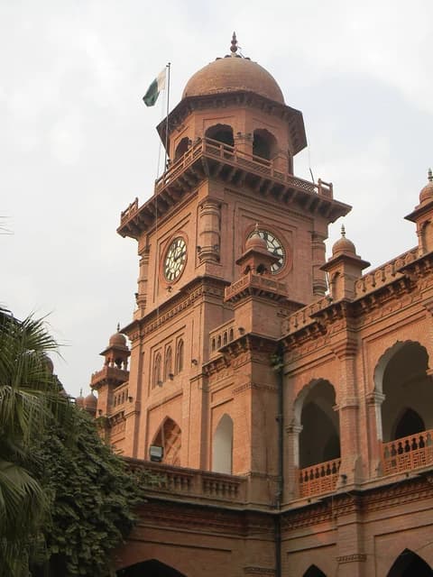 Clock tower and architectural details of the historic Punjab University building in Lahore.