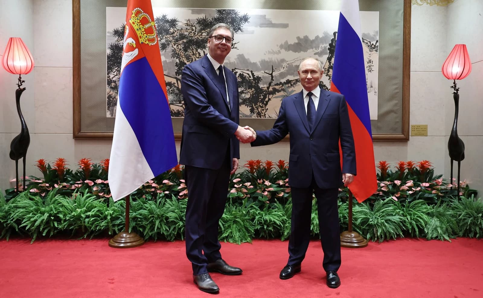 Aleksandar Vučić, President of Serbia, shaking hands with Vladimir Putin, President of Russia.