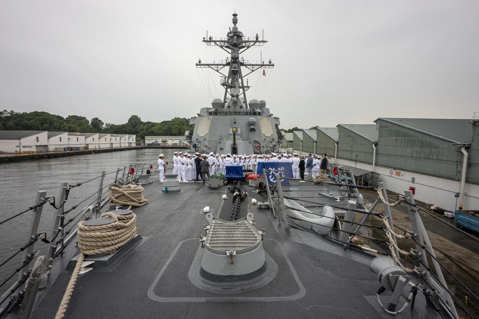 Sailors and U.S. Indo-Pacific Commander on the deck of the USS Dewey in Singapore.