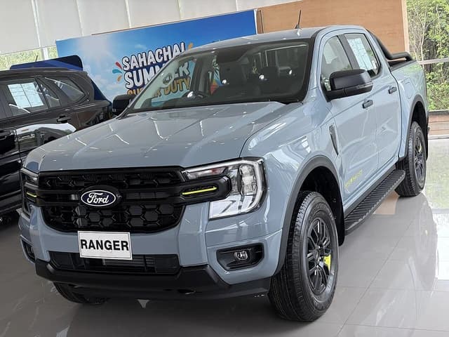 A grey 2026 Ford Ranger Wolftrak Double-Cab pickup truck on display in a showroom.