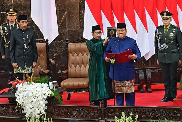 Prabowo Subianto, president of Indonesia, takes his oath of office.