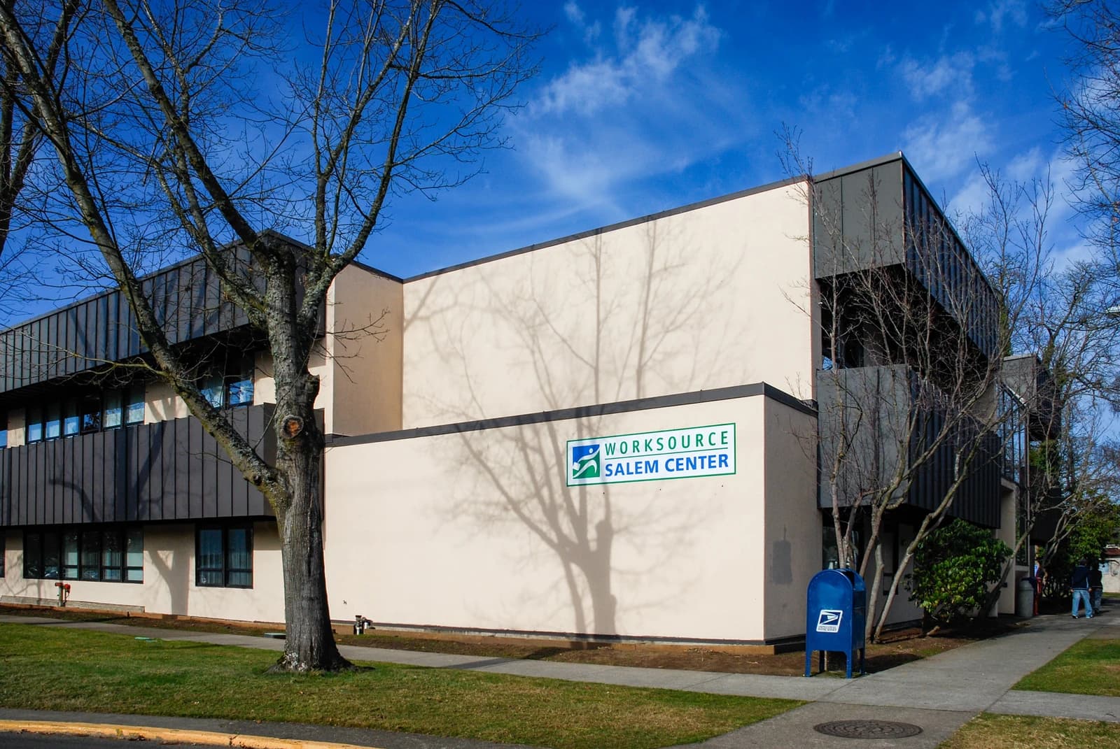 Exterior of the WorkSource Salem Center building under a clear blue sky.