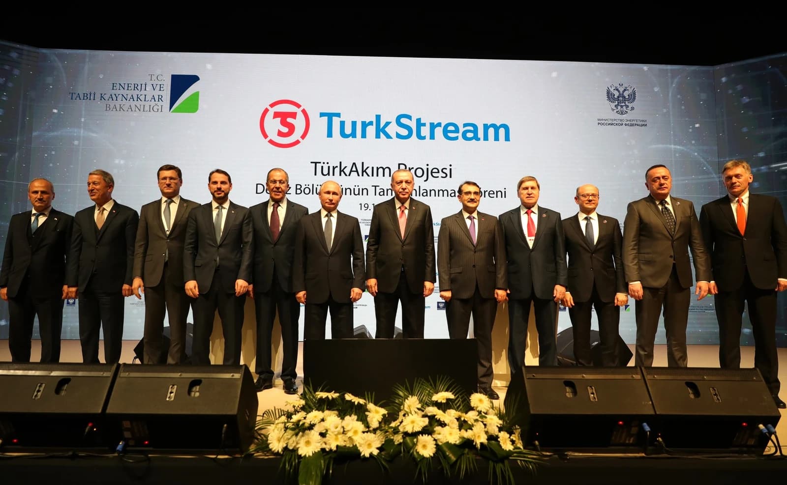 Turkish and Russian officials stand on stage at the TurkStream Gas Pipeline opening ceremony.