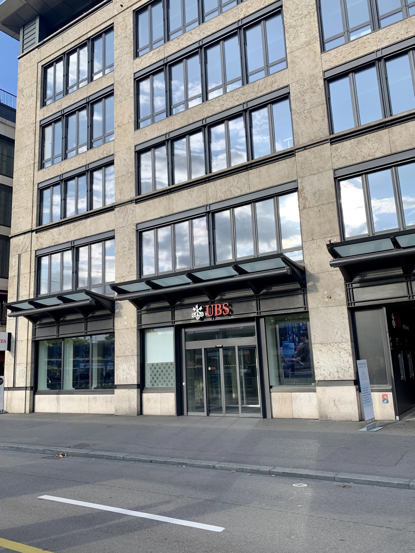 Exterior view of a UBS bank branch with the logo visible above the entrance.