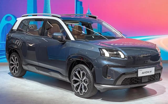 GAC Aion V electric SUV displayed at an automotive exhibition.