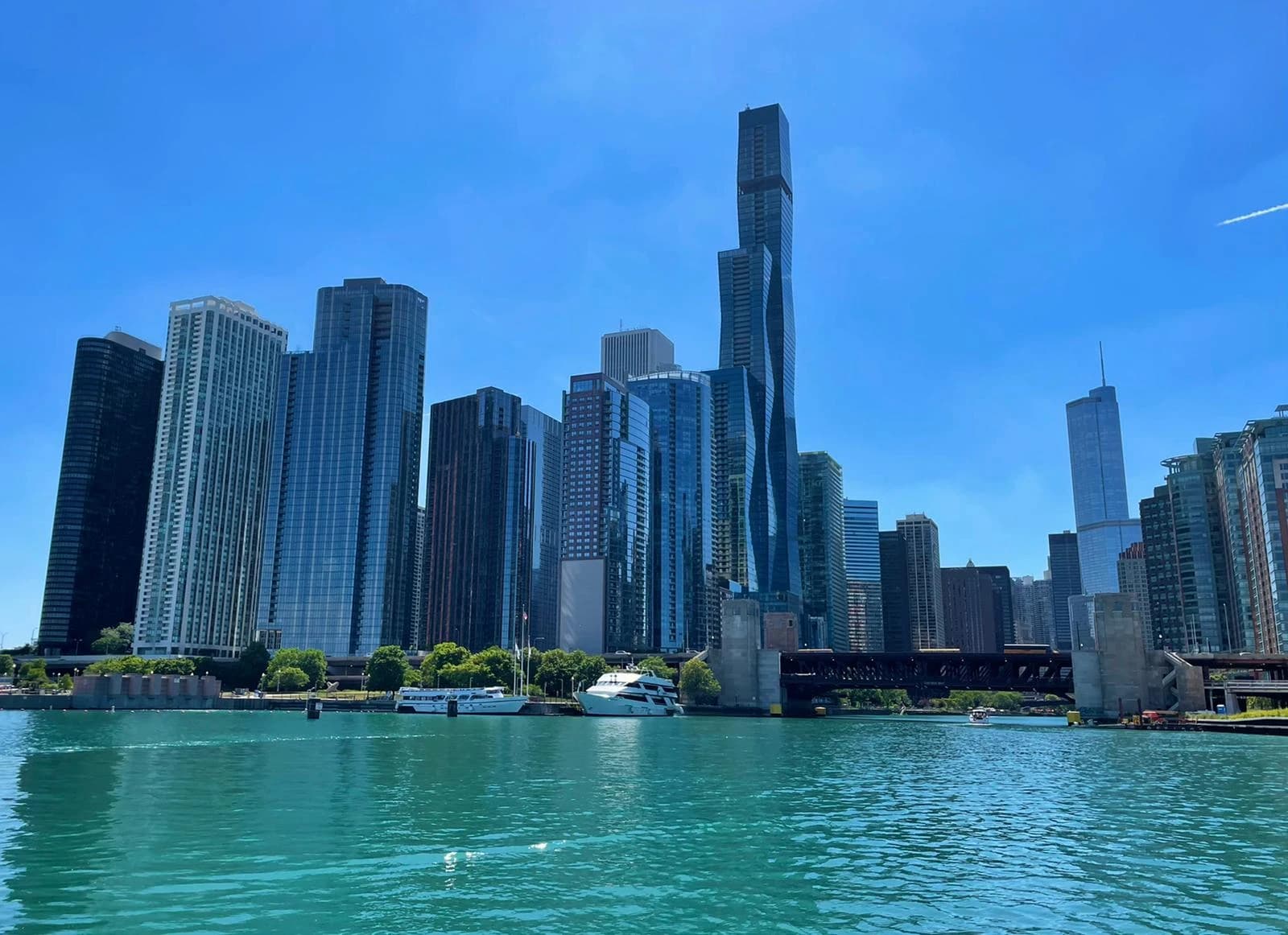 Modern high-rise buildings along a river in the business district of Chicago.