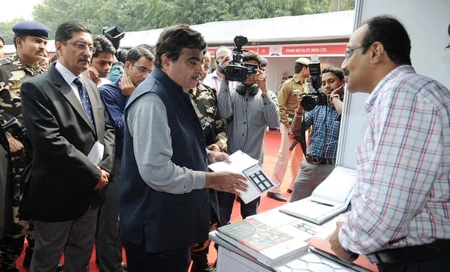 Nitin Gadkari, Union Minister, looking at materials at an exhibition in New Delhi.