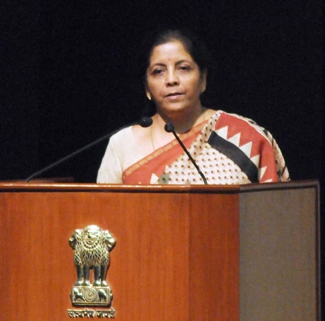Nirmala Sitharaman, Indian Minister, addressing an event at a podium.