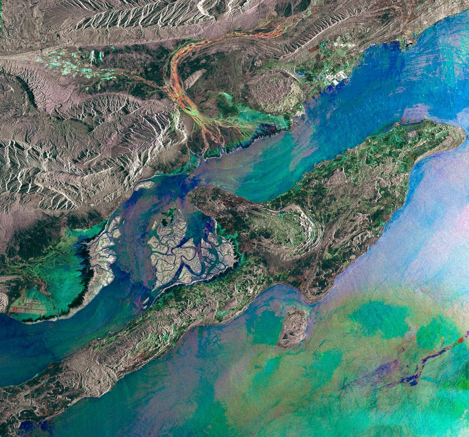 Satellite view showing the large island of Qeshm in the Strait of Hormuz.