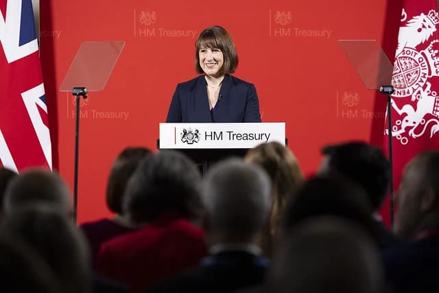 Rachel Reeves, Shadow Chancellor, speaking at a podium with HM Treasury branding.