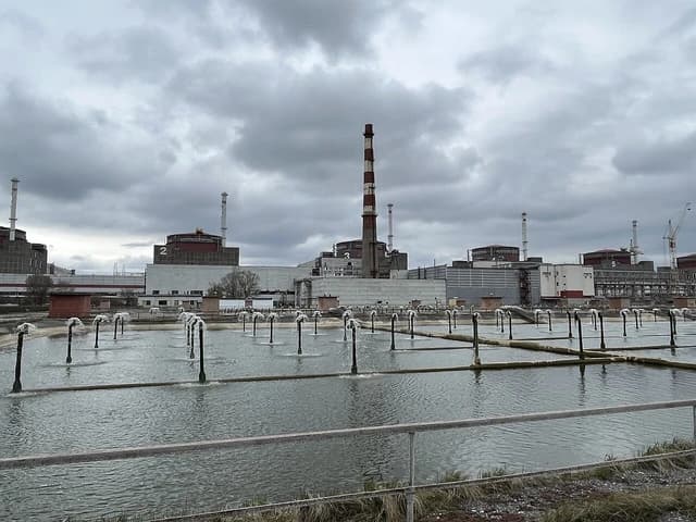 Zaporizhzhia Nuclear Power Plant complex with cooling ponds and reactor buildings.