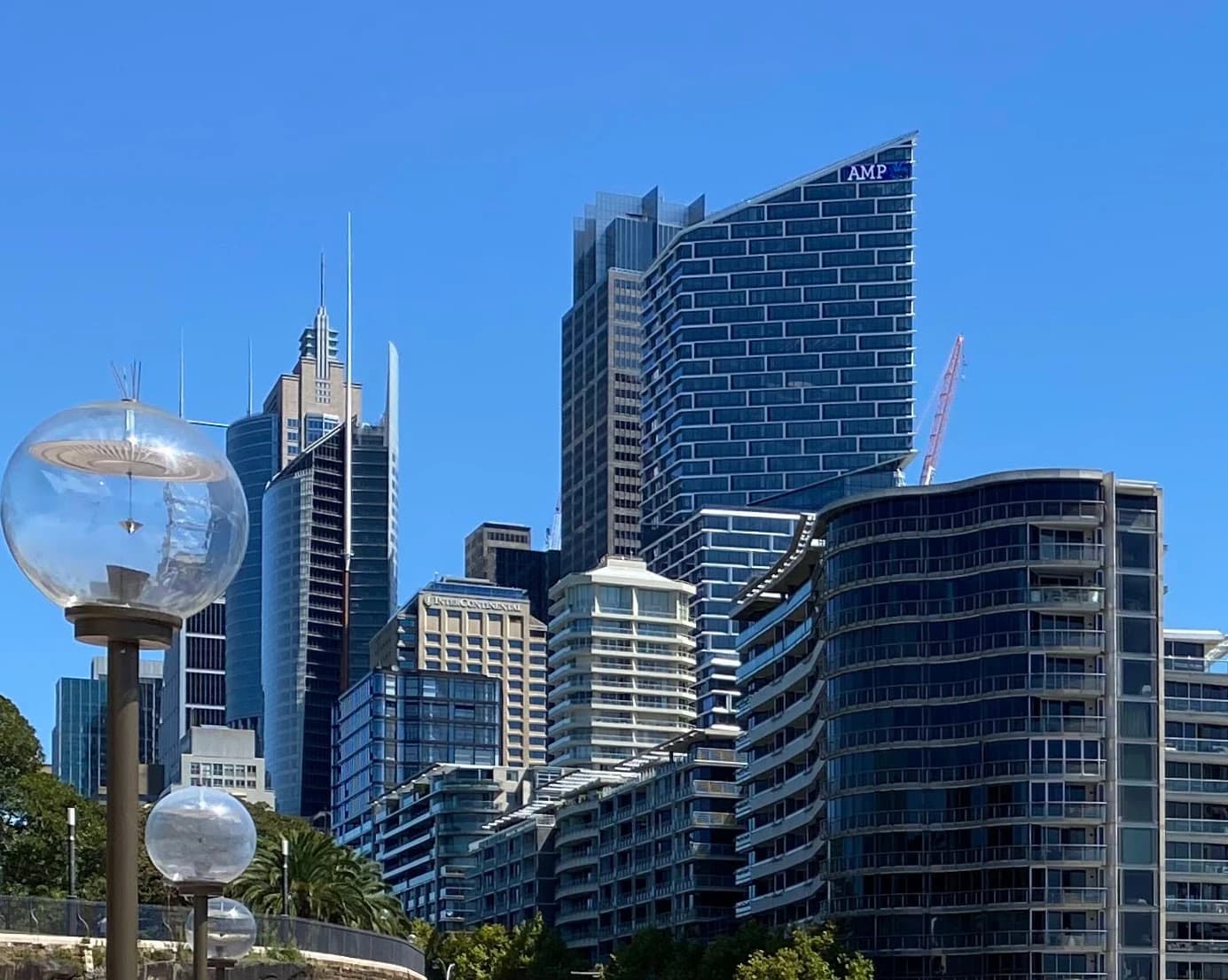 City skyline of Sydney Central Business District with various modern buildings under clear sky.