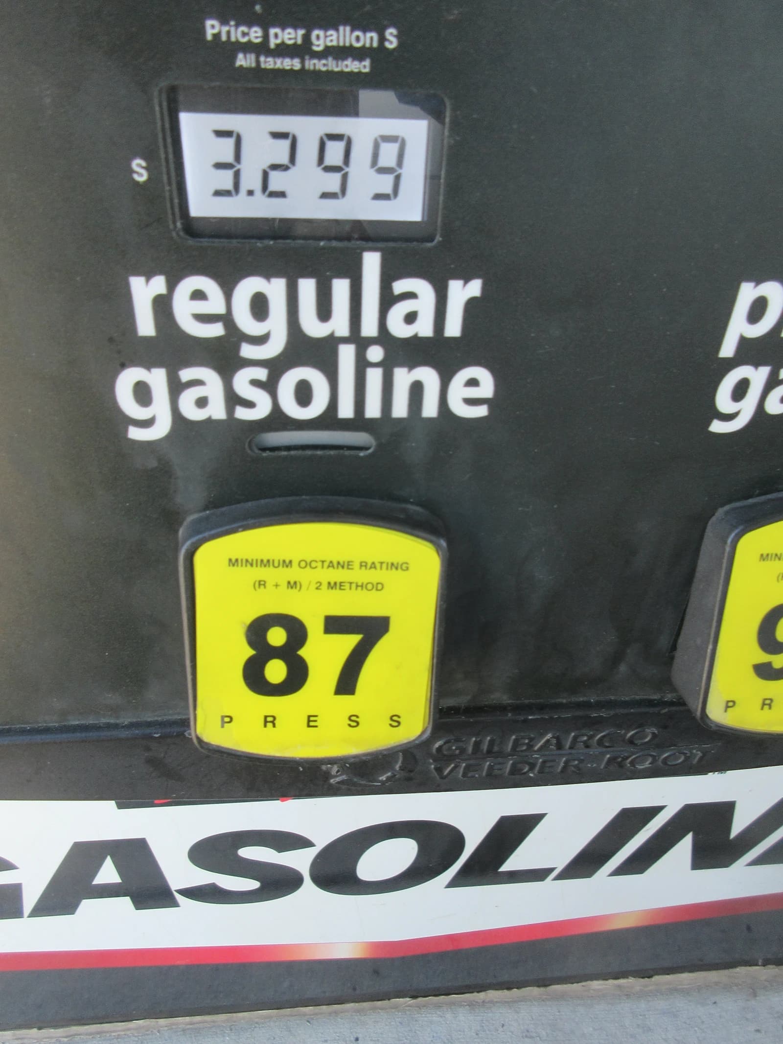 A gas pump at Costco displaying a price of $3.299 for regular gasoline.